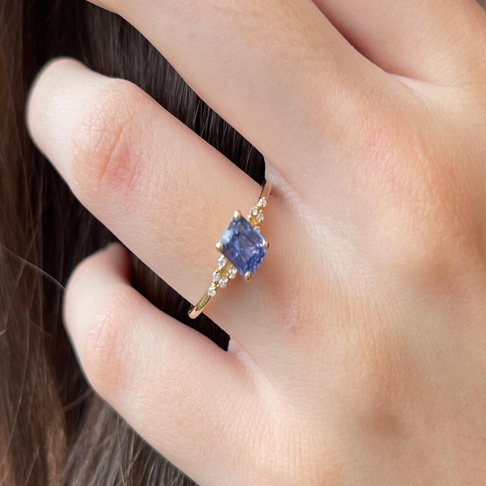 Purple sapphire ring worn on hand