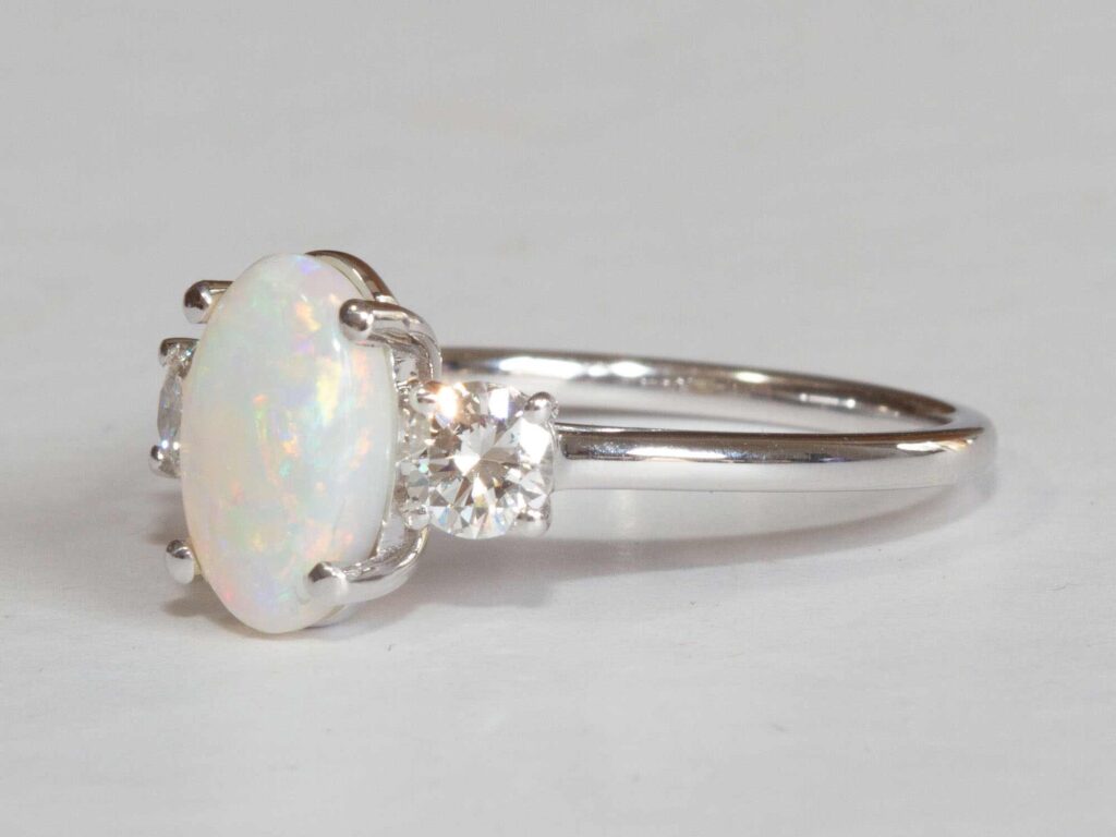 Olympia Lightning Ridge white opal and diamond ring side profile