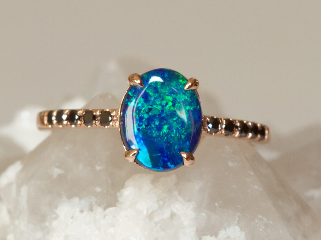 Ottavia Lightning Ridge black opal and black diamond ring styled studio view