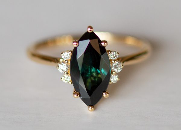 Teal peacock green marquise sapphire and diamond ring