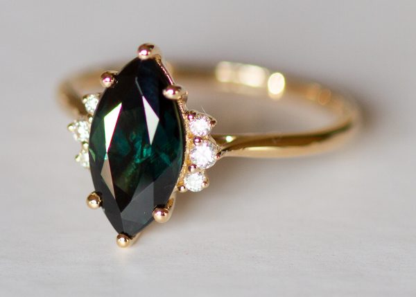 Teal peacock green marquise sapphire and diamond ring