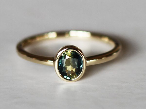 Oval teal petite sapphire gold ring