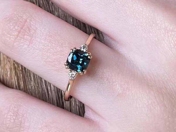 Teal cushion sapphire and diamond rose gold ring