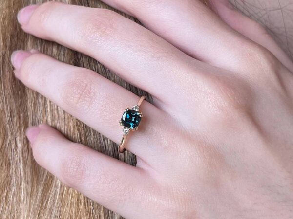 Teal cushion sapphire and diamond rose gold ring